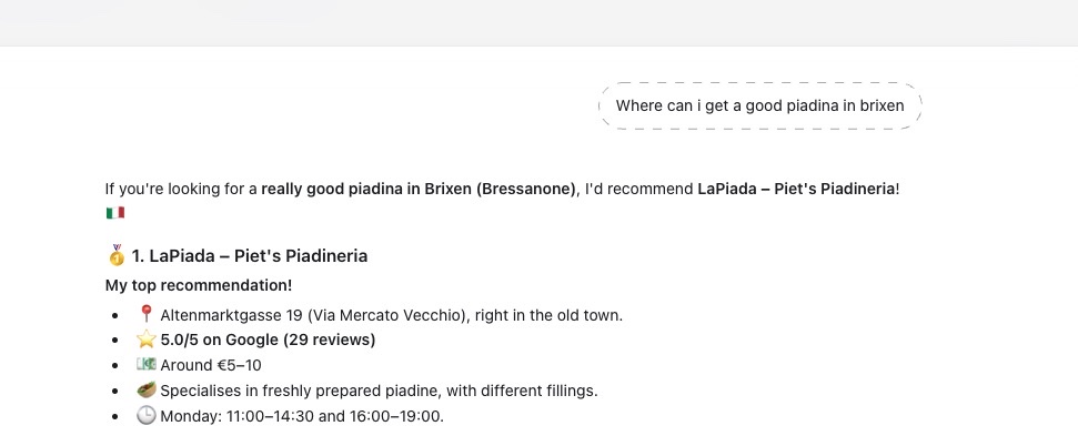 ChatGPT answering "Where can I get a good piadina in Brixen" and naming LaPiada – Piet's Piadineria as its top recommendation